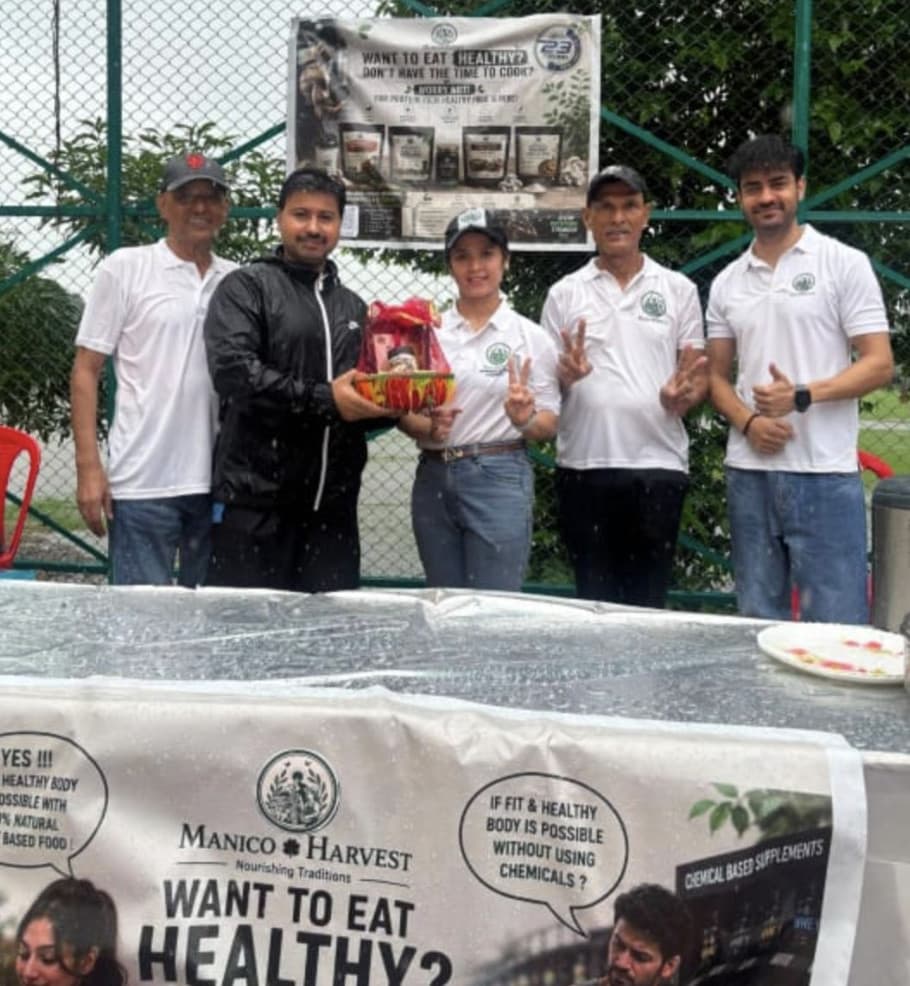 The founder with her father, uncle and younger brother at the Manico Harvest stall