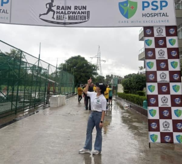 Founder under the Rain Run Haldwani finish arch
